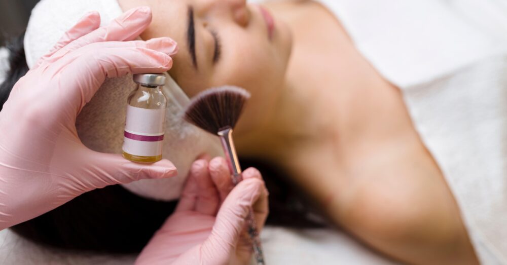 Woman receiving a professional VI chemical peel treatment. Not a real patient.