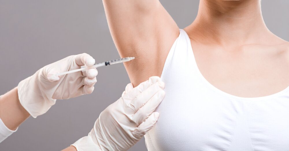 Woman receiving underarm Botox injections for hyperhidrosis or underarm sweating